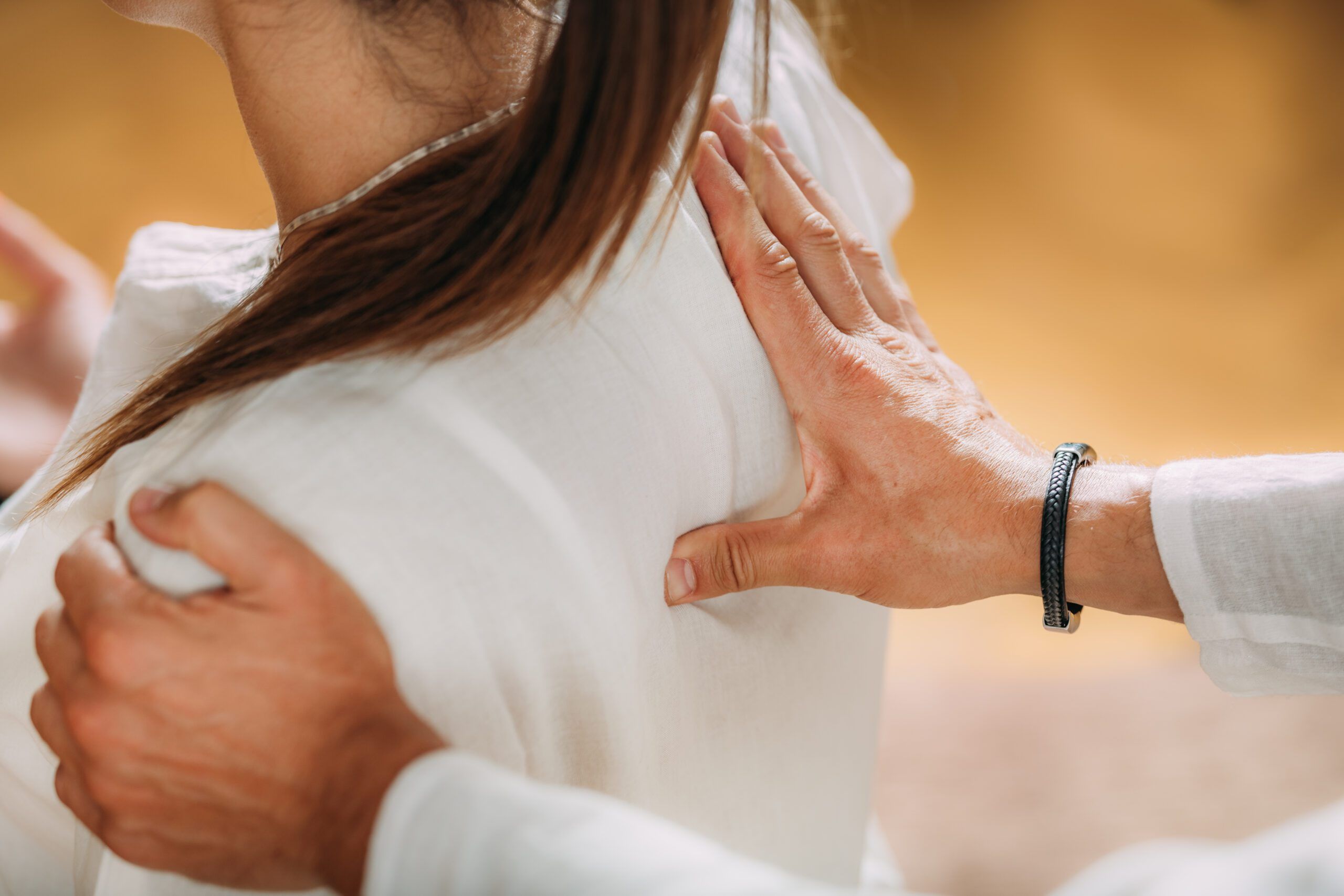 Woman enjoying shiatsu neck and shoulders massage.